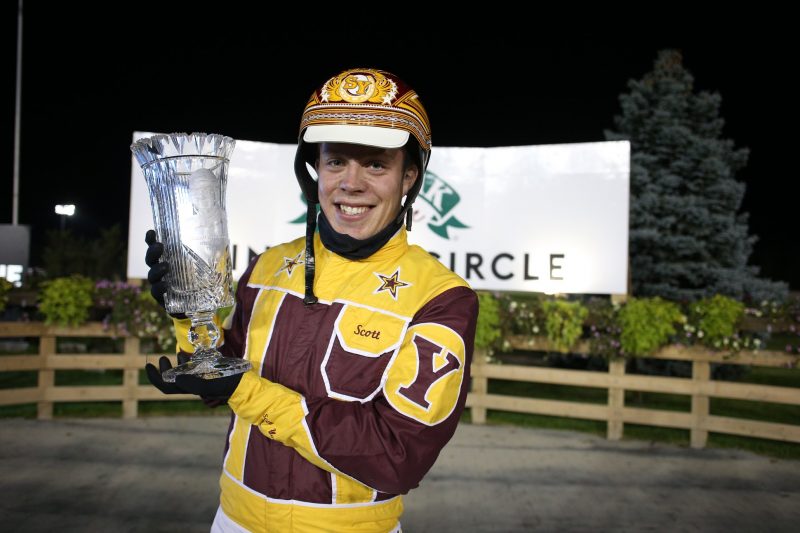 Scott Young poses with a trophy after winning last year's William Wellwood Memorial with On A Streak.