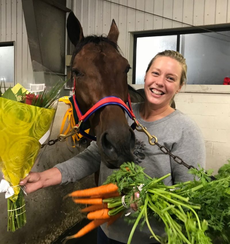 Emelia Gillespie enjoying her spoils on 2021 Caretaker Appreciation Day at Woodbine Mohawk Park. 