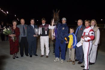Scott McKelvie presenting the OSS Super Final trophy in 2000 to the connections of 3-year-old pacing filly Legacy Of Fame. (New Image Media)