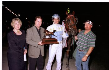 Scott McKelvie presenting the trophy for the 2000 Classic Distaff Final, who by Galleria. (New Image Media)