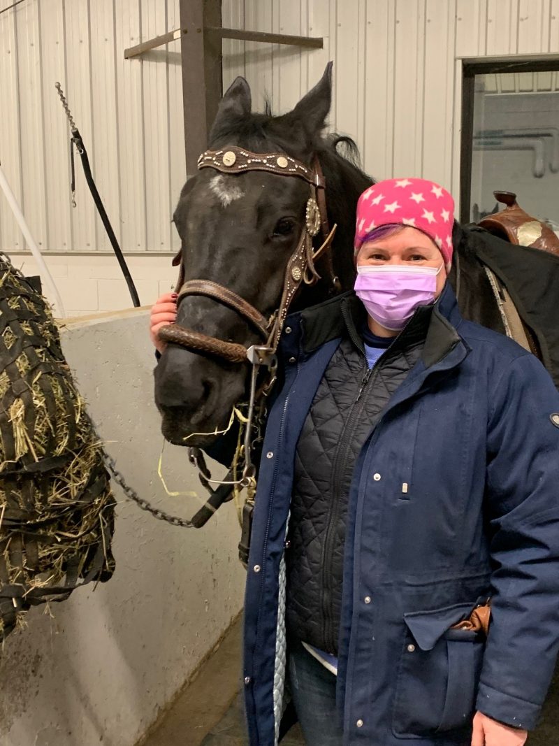 Woodbine Mohawk Park outrider Joanne Colville sporting a purple mask in support of International Women's Day.