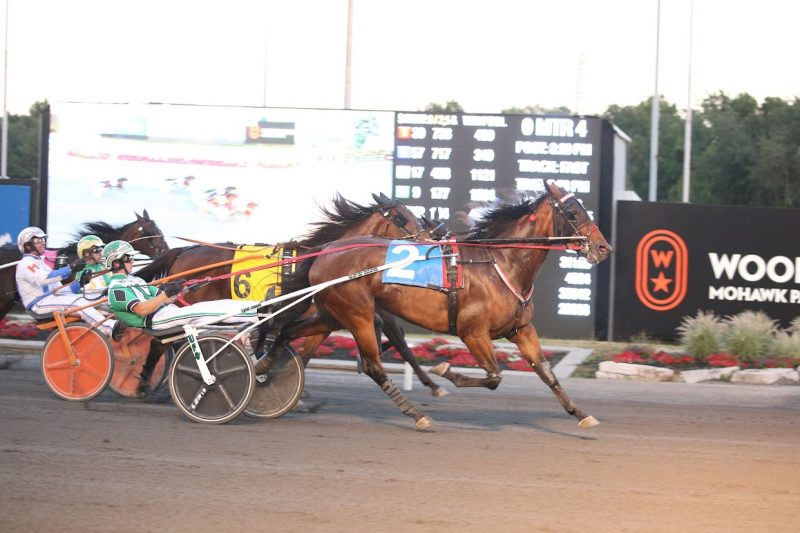 Driver Tyler Jones and Classic Magic winning on July 26, 2022 at Woodbine Mohawk Park (New Image Media)