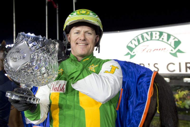Jody Jamieson poses with the Metro Pace trophy after winning with Captains Quarters in September 2023.